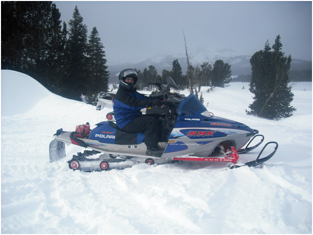 RealRanchers Jim and Timmery Hellyer from Lander, Wyo. take a break from feeding their beef cattle to snowmobile.